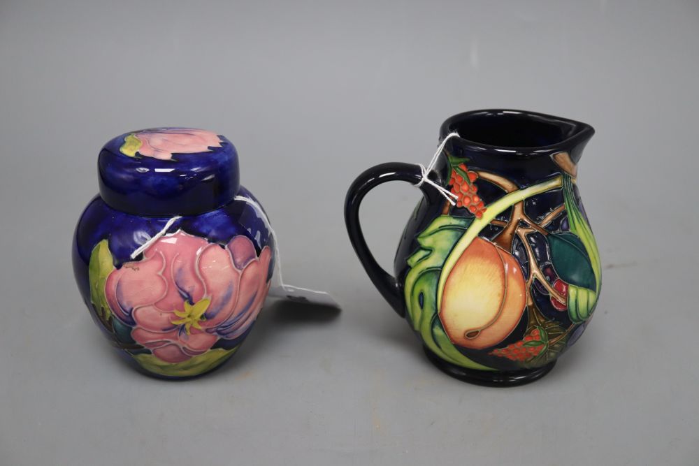 A Moorcroft Queens Choice blue ground bulbous jug and a Hibiscus ginger jar and cover, tallest 12cm